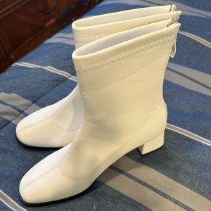 White Go go boots. Snakeskin espadrilles for $25.00 or, $10.00 a piece.